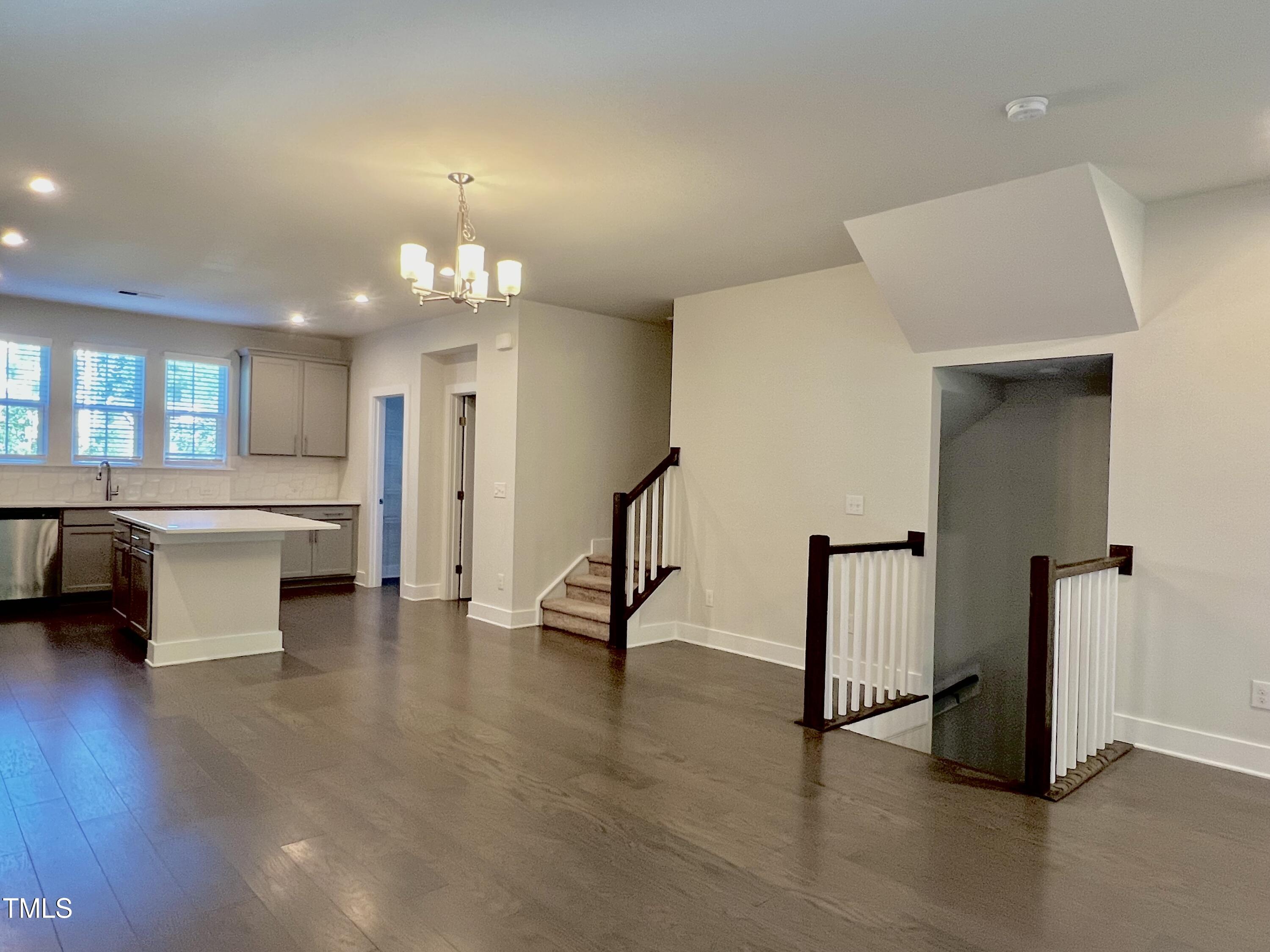 906 Waterside View Drive Raleigh, NC 27606 - Photo 6 of 27 a view of a room with gym equipment and a large window