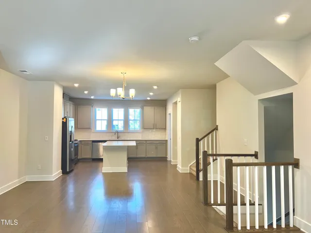 a view of kitchen and dining room with wooden floor