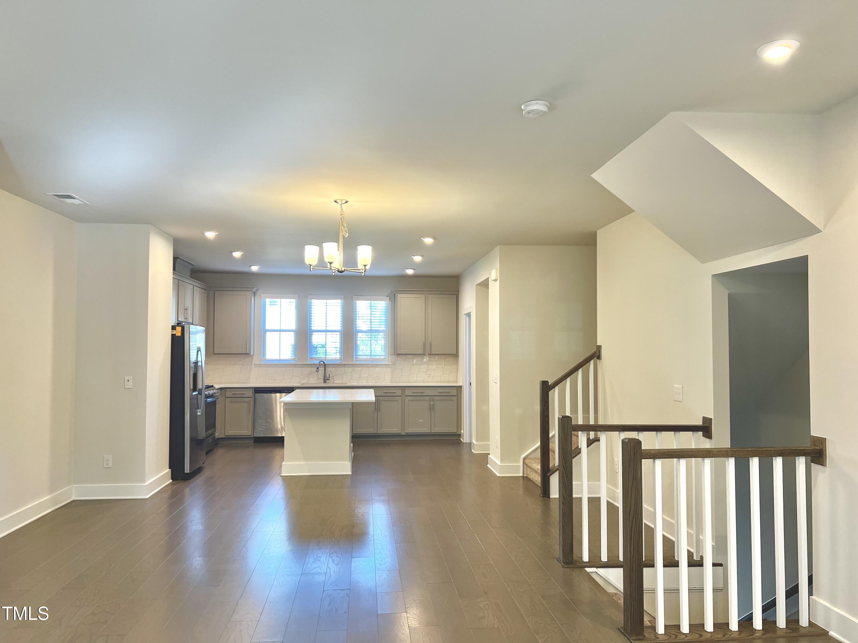 906 Waterside View Drive Raleigh, NC 27606 - Photo 7 of 27 a view of a dining room with furniture window and wooden floor