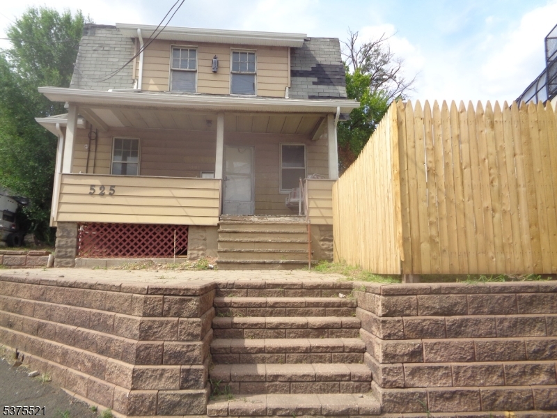 a view of house with door and outdoor space