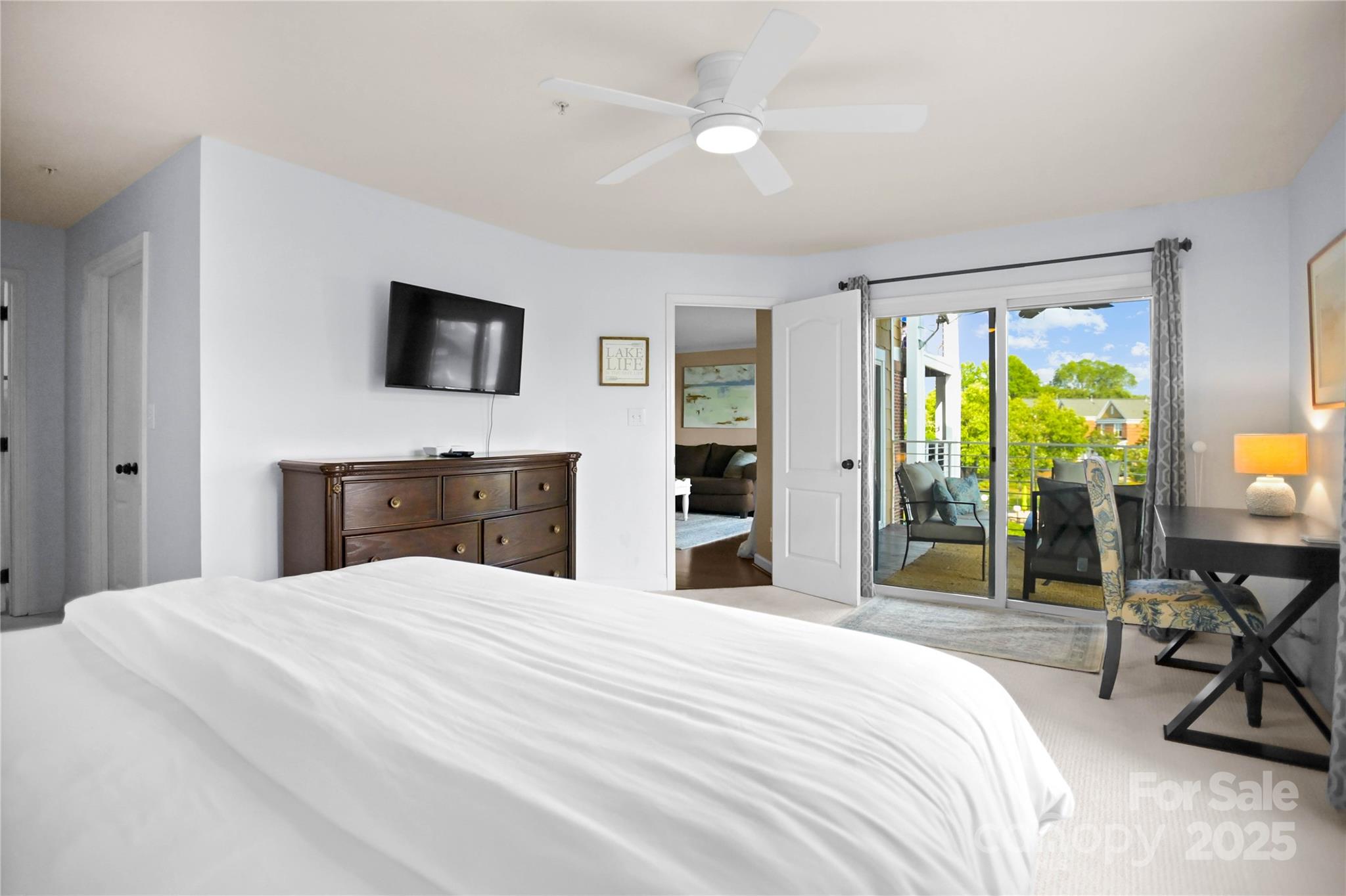 18525 Harborside Drive Cornelius, NC 28031 - Photo 15 of 32 a bedroom with a bed and a flat screen tv