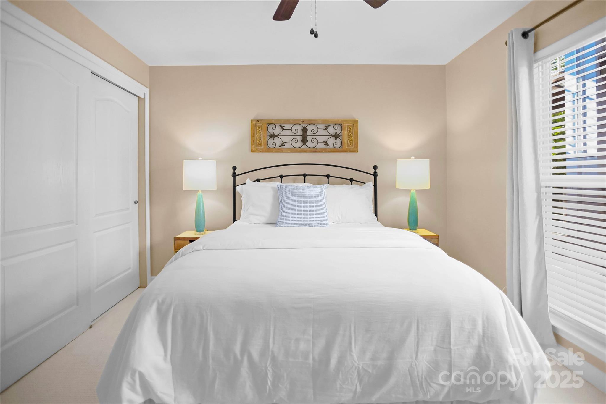 18525 Harborside Drive Cornelius, NC 28031 - Photo 18 of 32 a bedroom with a bed and a window