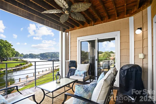 a swimming pool with outdoor seating and yard