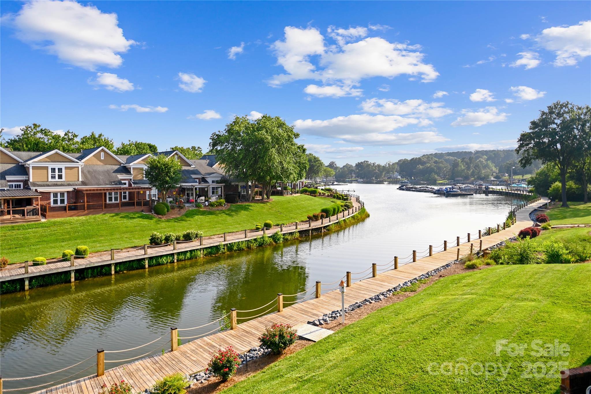 18525 Harborside Drive Cornelius, NC 28031 - Photo 24 of 32 a view of a lake with a city view