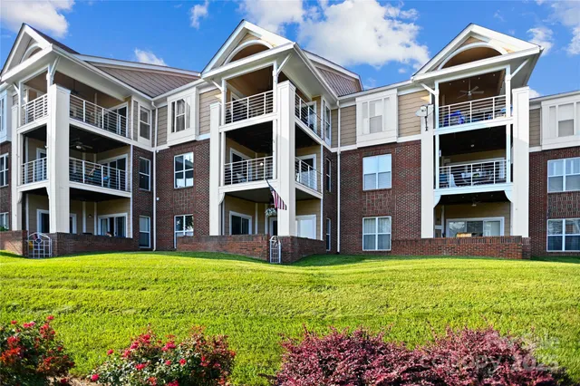 a view of a building with a yard