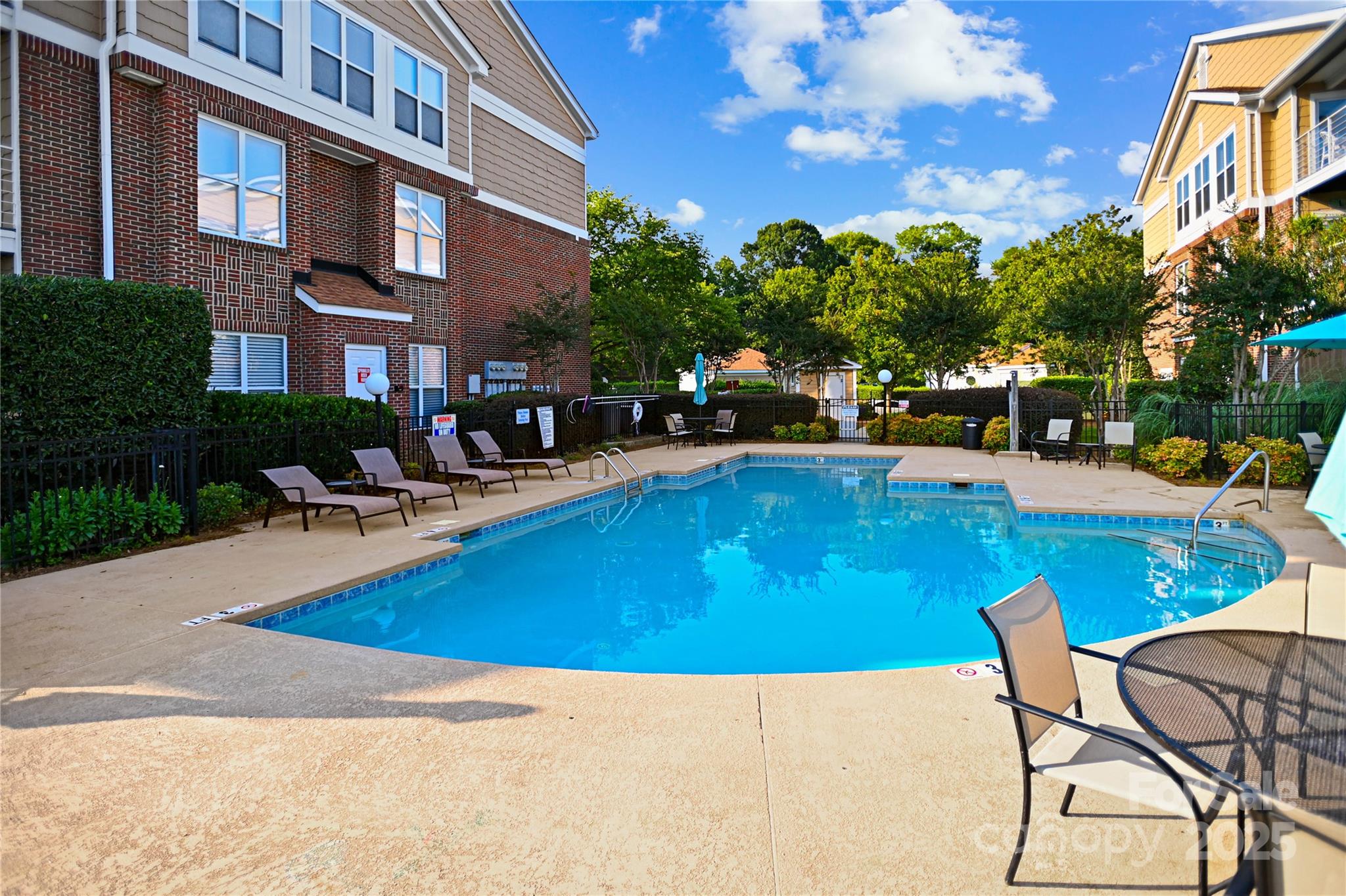 18525 Harborside Drive Cornelius, NC 28031 - Photo 27 of 32 a swimming pool with outdoor seating and yard