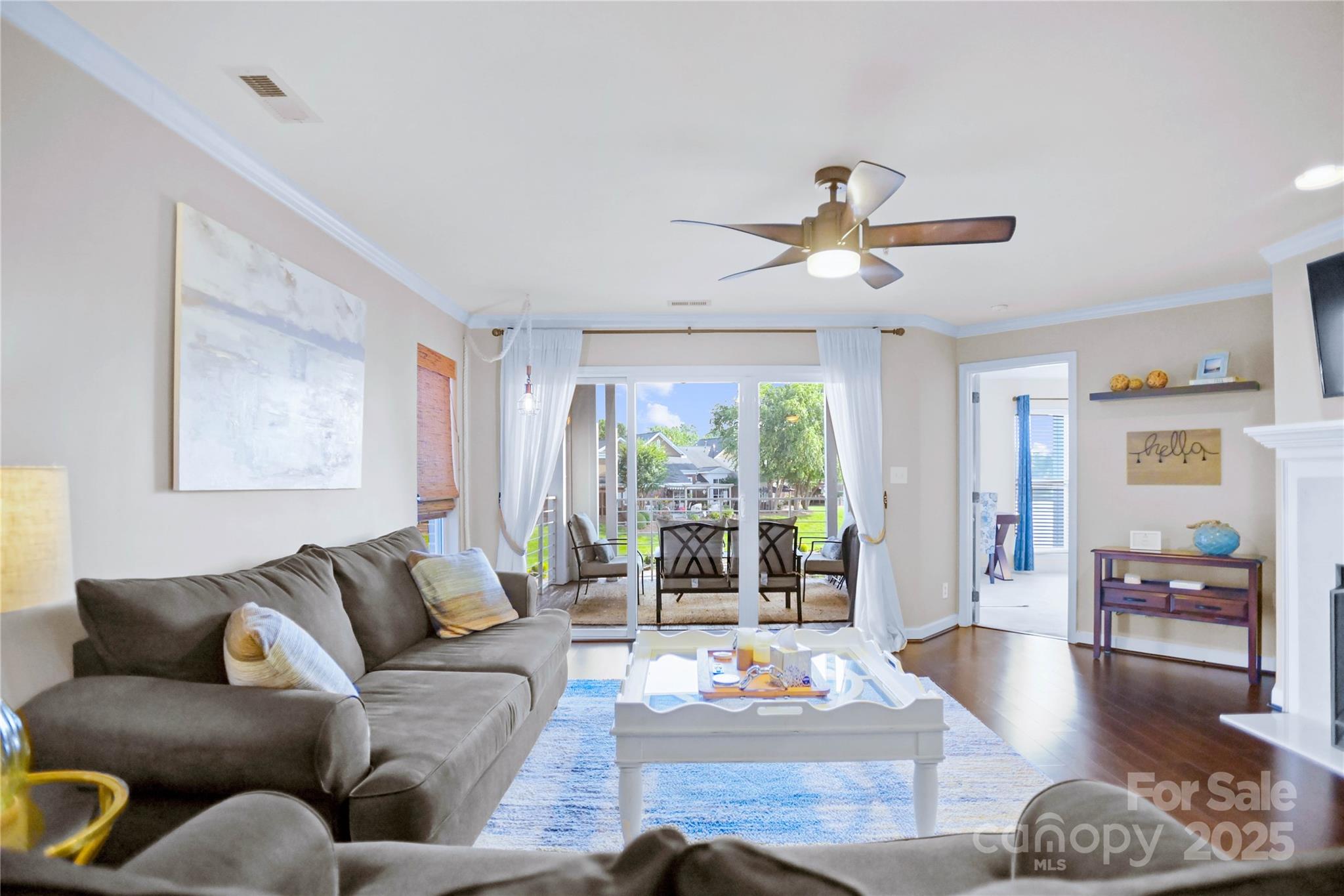 18525 Harborside Drive Cornelius, NC 28031 - Photo 5 of 32 a living room with furniture ceiling fan and a window