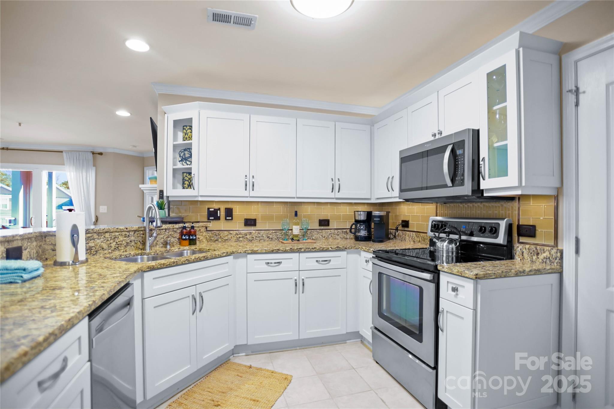 18525 Harborside Drive Cornelius, NC 28031 - Photo 10 of 32 a kitchen with a sink stove and cabinets