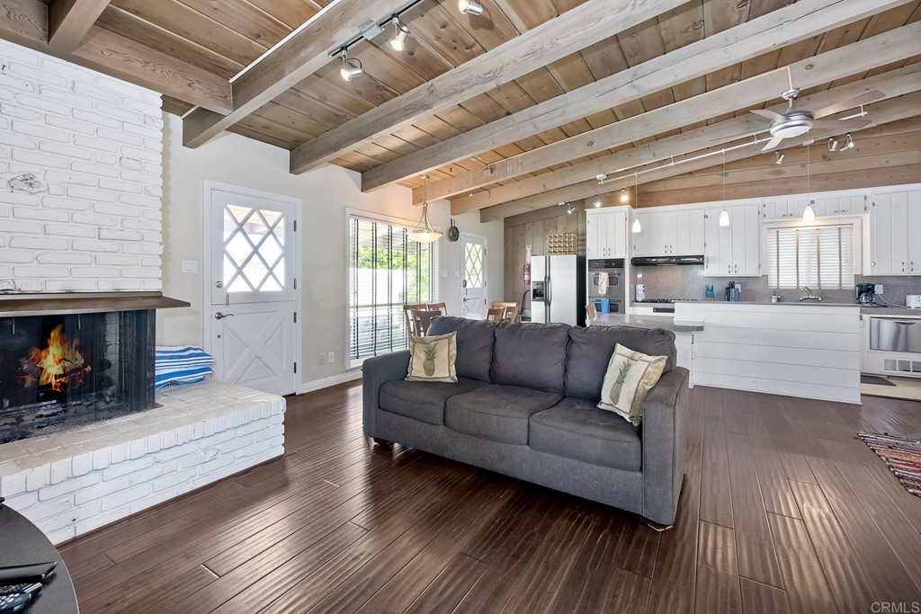 367 Beech Avenue Carlsbad, CA 92008 - Photo 13 of 23 a living room with furniture and a fireplace