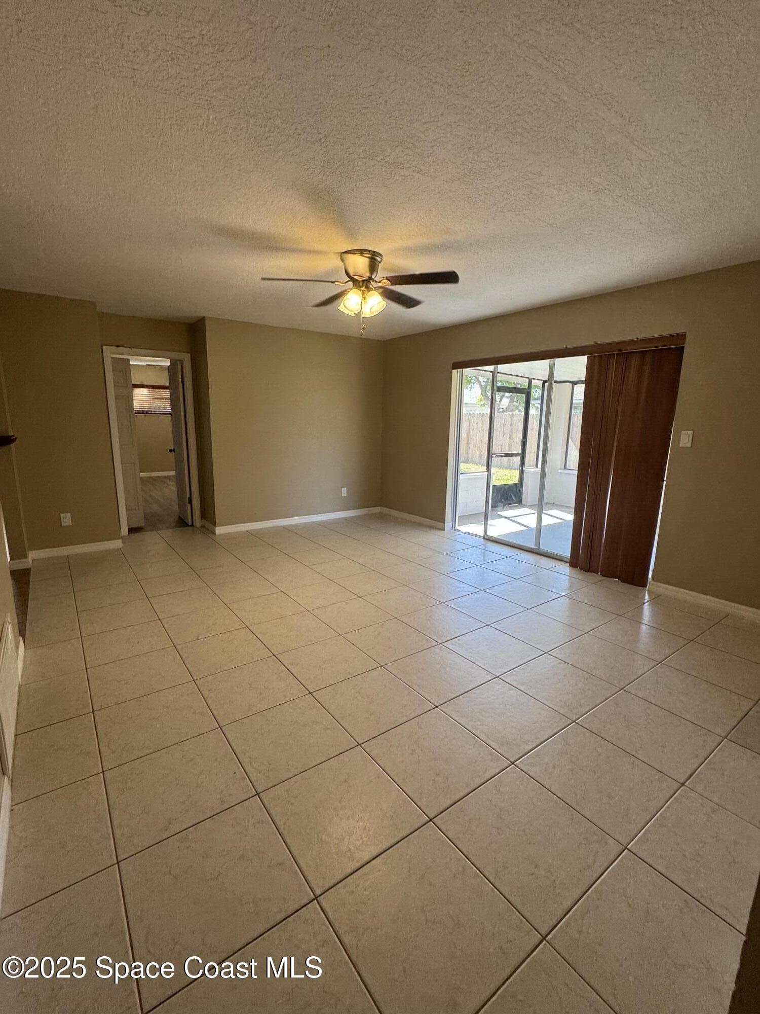 997 Beacon Road Rockledge, FL 32955 - Photo 11 of 18 a view of an empty room and window