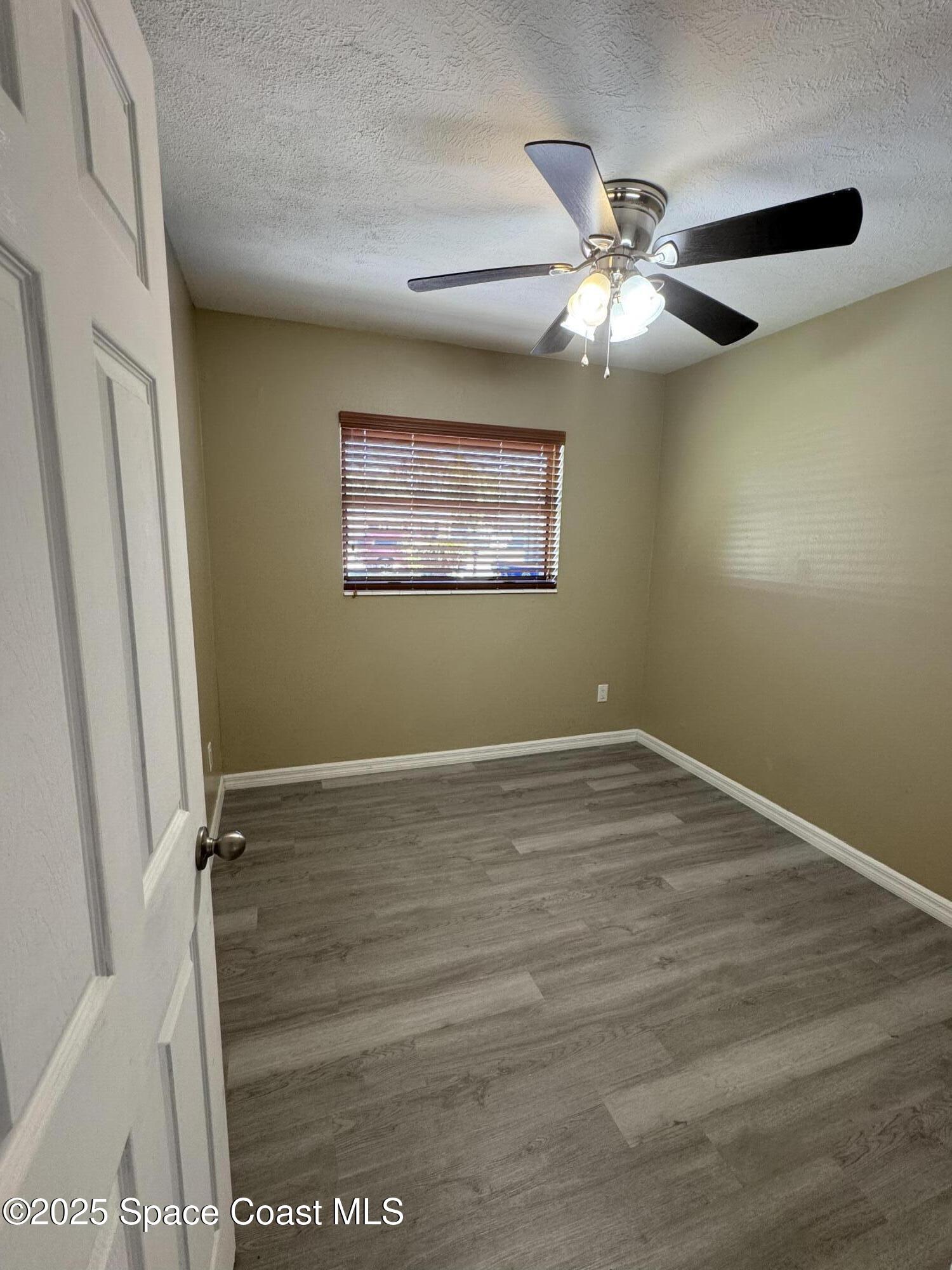 997 Beacon Road Rockledge, FL 32955 - Photo 12 of 18 a view of an empty room with a window