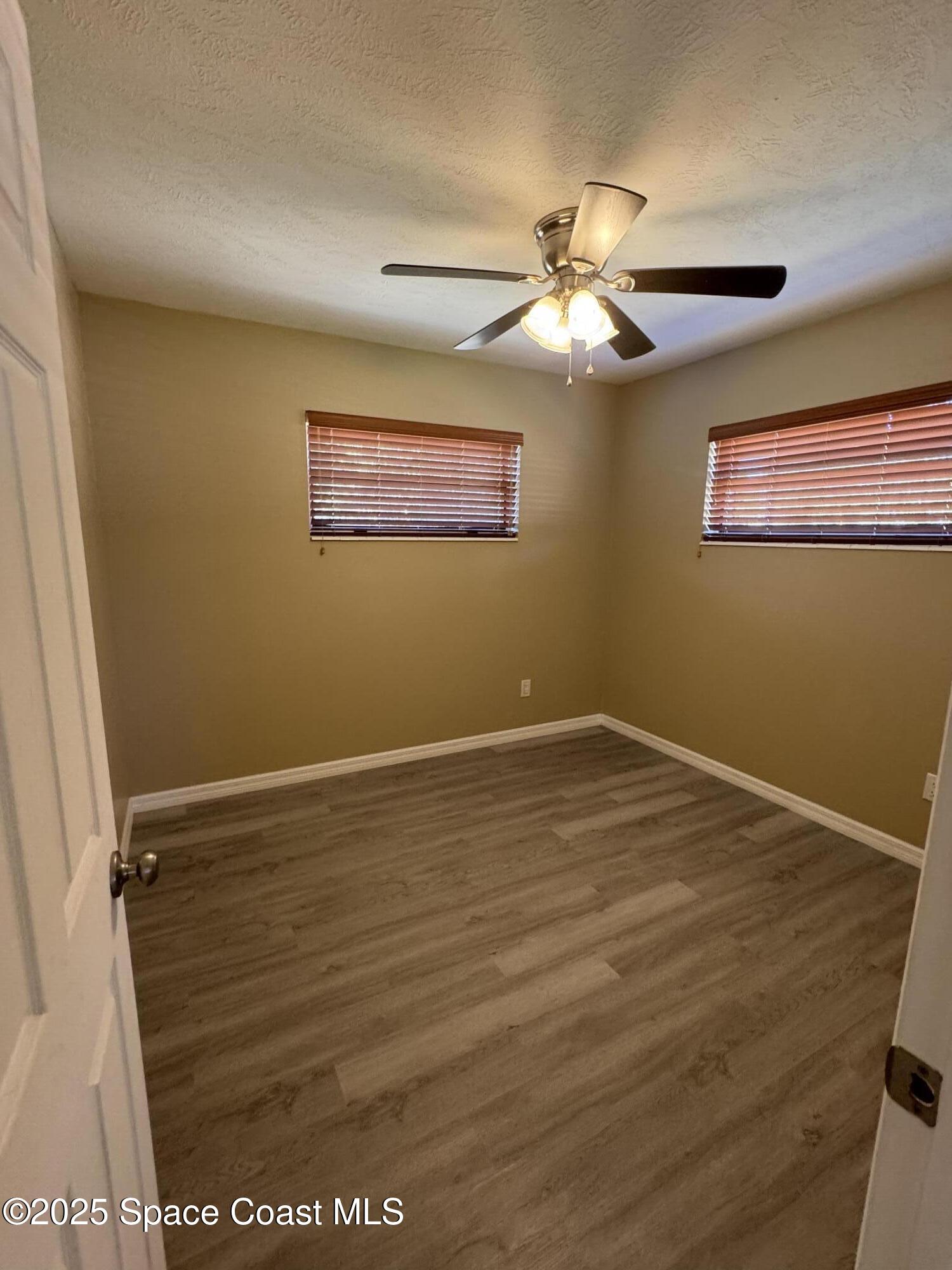 997 Beacon Road Rockledge, FL 32955 - Photo 18 of 18 a view of a room with wooden floor