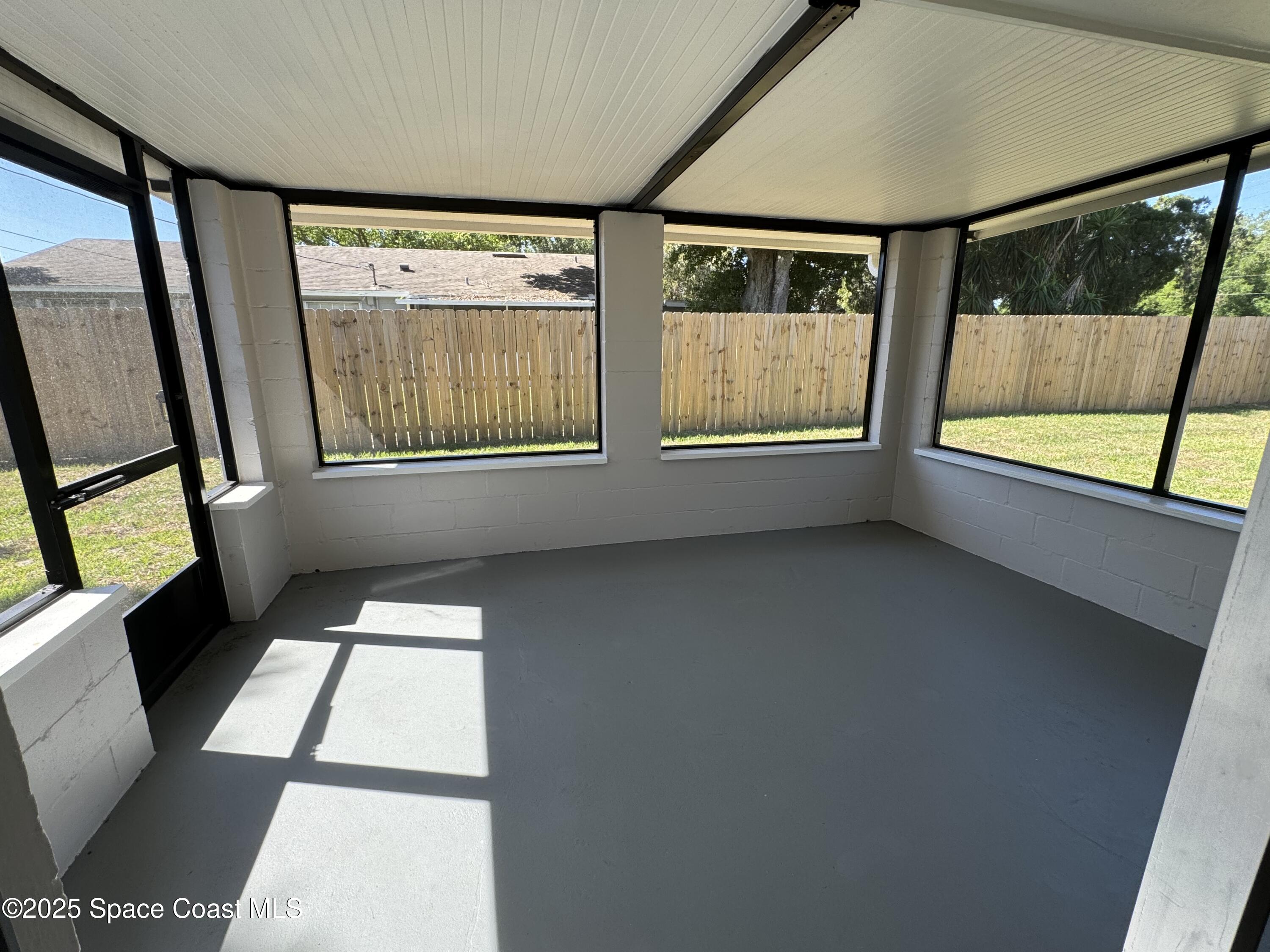 997 Beacon Road Rockledge, FL 32955 - Photo 5 of 18 a view of an empty room with a window