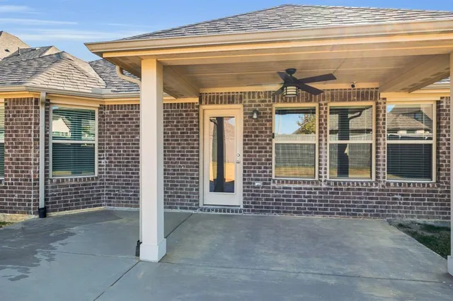 a view of a house with a door and wooden floor