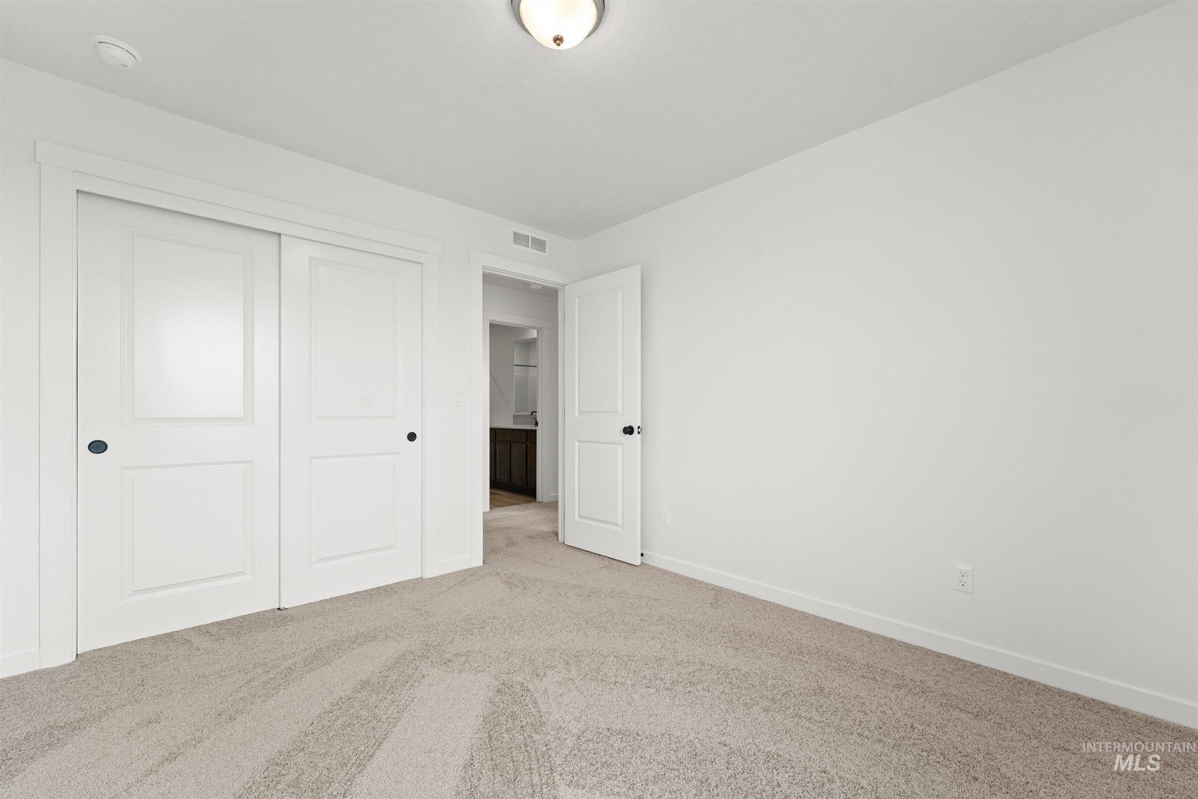 1076 East Exploration Drive Kuna, ID 83634 - Photo 25 of 29 Unfurnished bedroom featuring carpet and a closet
