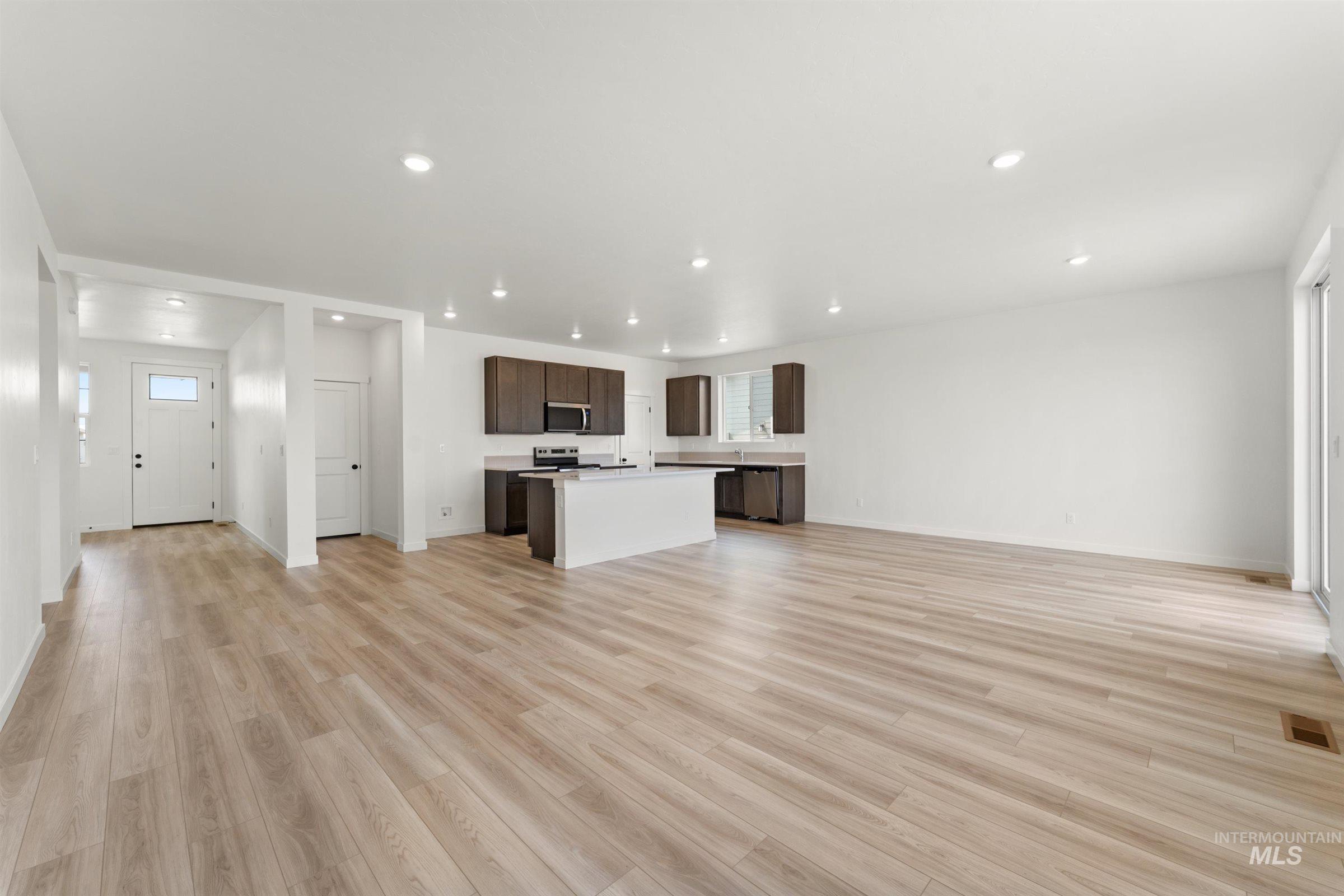 1076 East Exploration Drive Kuna, ID 83634 - Photo 3 of 29 Unfurnished living room featuring recessed lighting and light wood-type flooring