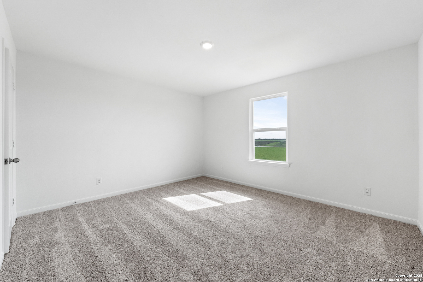 16036 Stratford Cove Lytle, TX 78052 - Photo 14 of 28 an empty room with a window