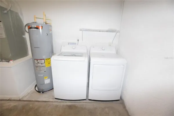 a utility room with dryer and washer