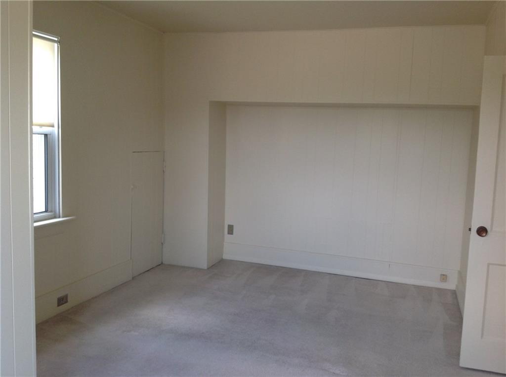 602 Friday Road Pittsburgh, PA 15209 - Photo 14 of 25 Master Bedroom with door that leads to attic area for additional storage.