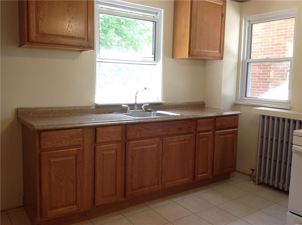 602 Friday Road Pittsburgh, PA 15209 - Photo 8 of 25 Kitchen with ceramic floor and newer counter tops.