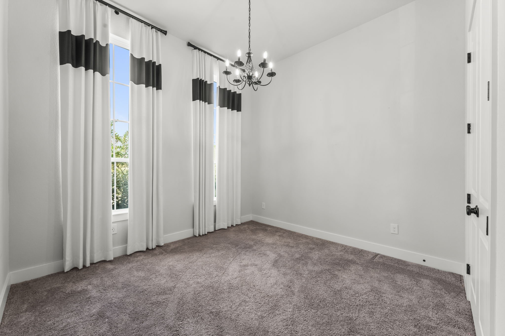 17151 Sandstone Street Conroe, TX 77302 - Photo 16 of 38 a view of a room with a chandelier fan and closet