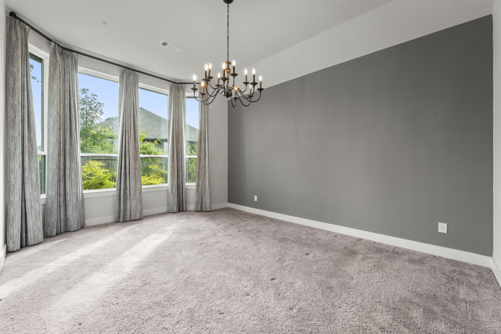 17151 Sandstone Street Conroe, TX 77302 - Photo 18 of 38 a view of a livingroom with a chandelier fan and windows