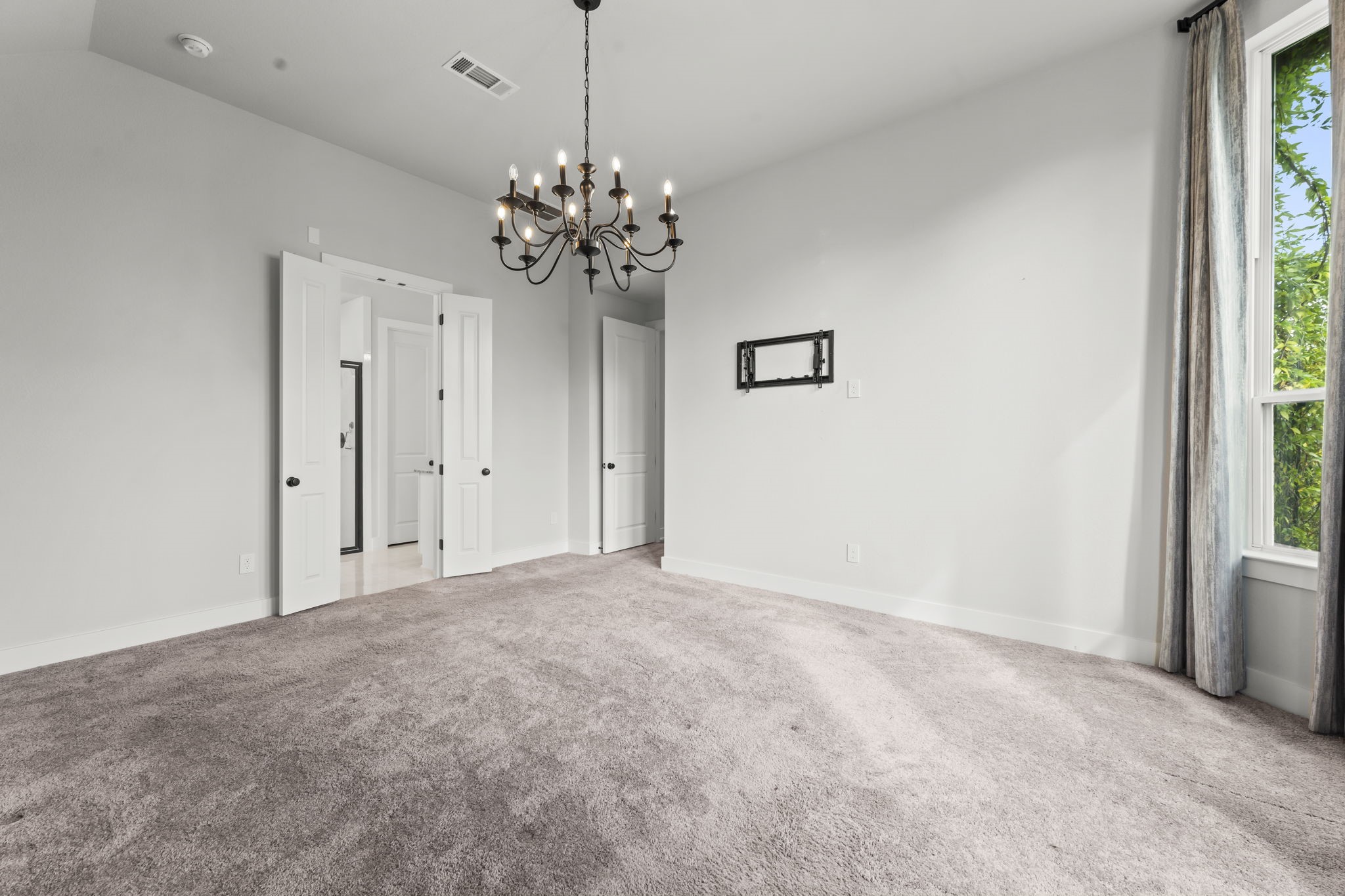 17151 Sandstone Street Conroe, TX 77302 - Photo 19 of 38 a view of a chandelier in big room and chandelier