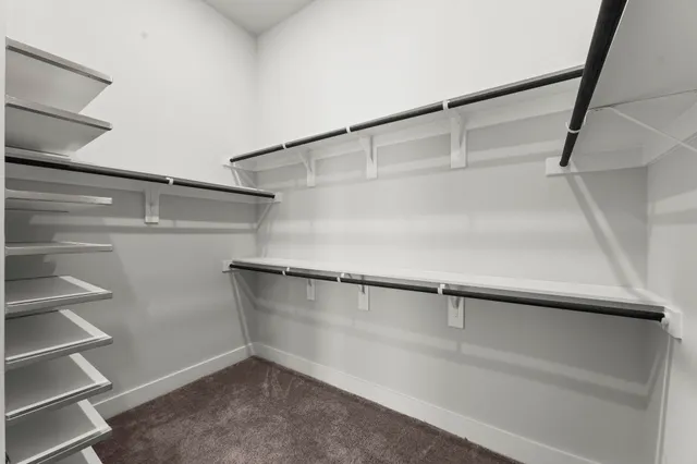 a view of an empty walk in closet