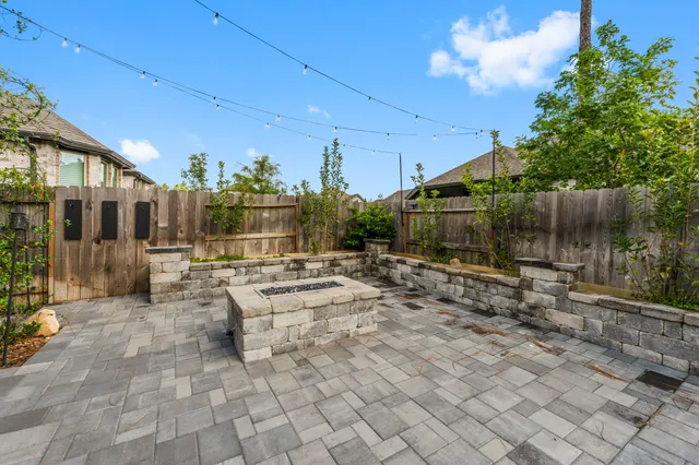 a view of yard with patio