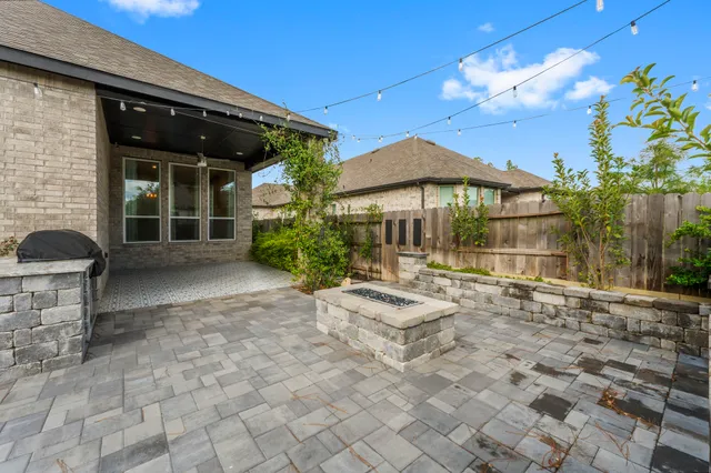 a view of a chair and tables in the patio