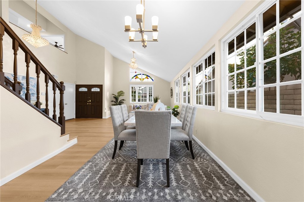 20329 Rim Ridge Road Walnut, CA 91789 - Photo 12 of 46 a view of a dining room with furniture a rug and wooden floor