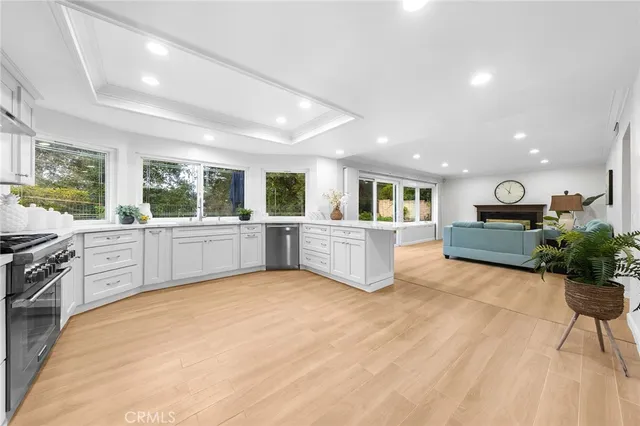a large kitchen with a sink and cabinets