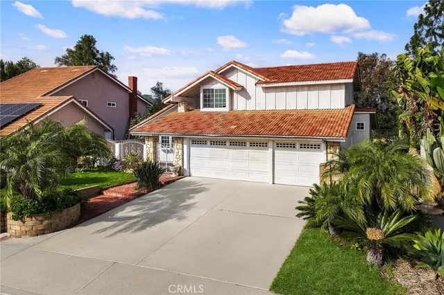 a view of a house with a yard and plants