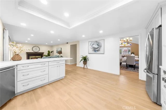 a hall with a lot of cabinet and a large mirror