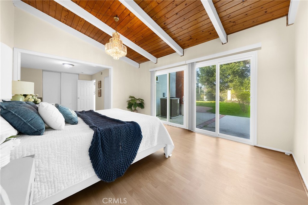 20329 Rim Ridge Road Walnut, CA 91789 - Photo 25 of 46 a spacious bedroom with a large bed and a large window