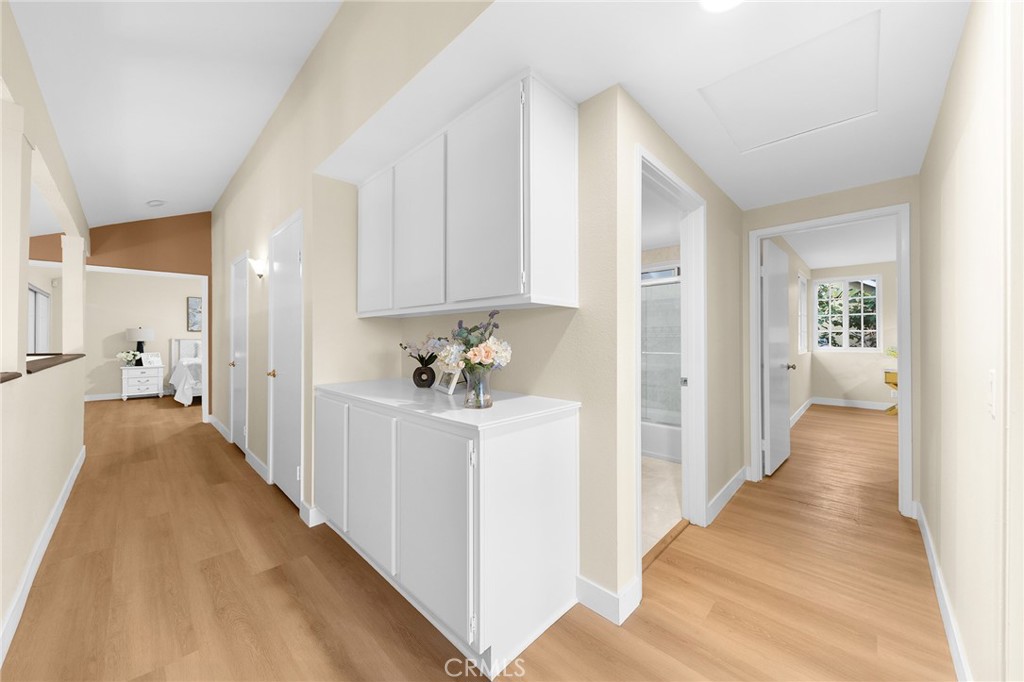 20329 Rim Ridge Road Walnut, CA 91789 - Photo 31 of 46 a view of a hallway with white cabinets and a couch