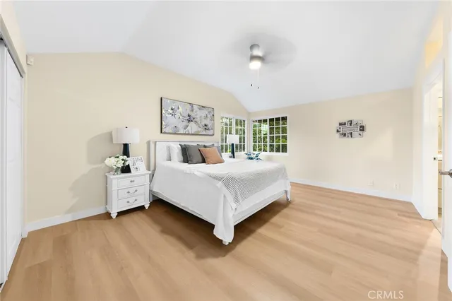 a bedroom with a bed and a night stand