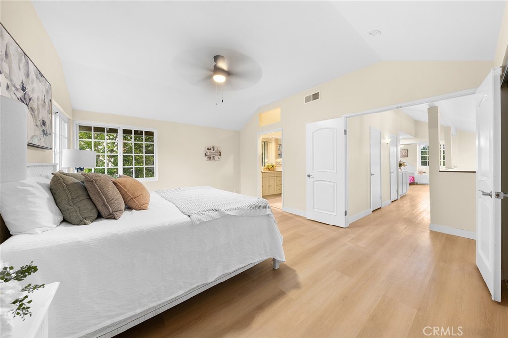 20329 Rim Ridge Road Walnut, CA 91789 - Photo 33 of 46 a bedroom with a large bed and a chandelier