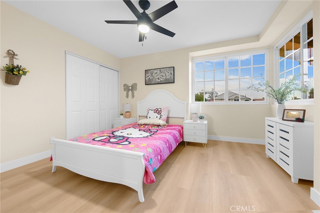 20329 Rim Ridge Road Walnut, CA 91789 - Photo 37 of 46 a bedroom with a bed and a chandelier