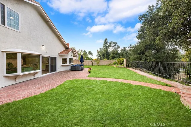 a view of house with a big yard