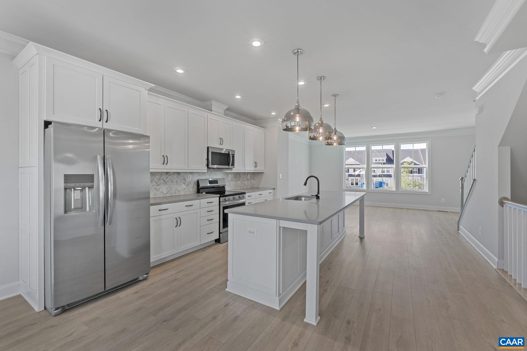 107 Park Ridge Drive Crozet, VA 22932 - Photo 16 of 42 a kitchen with white cabinets and stainless steel appliances