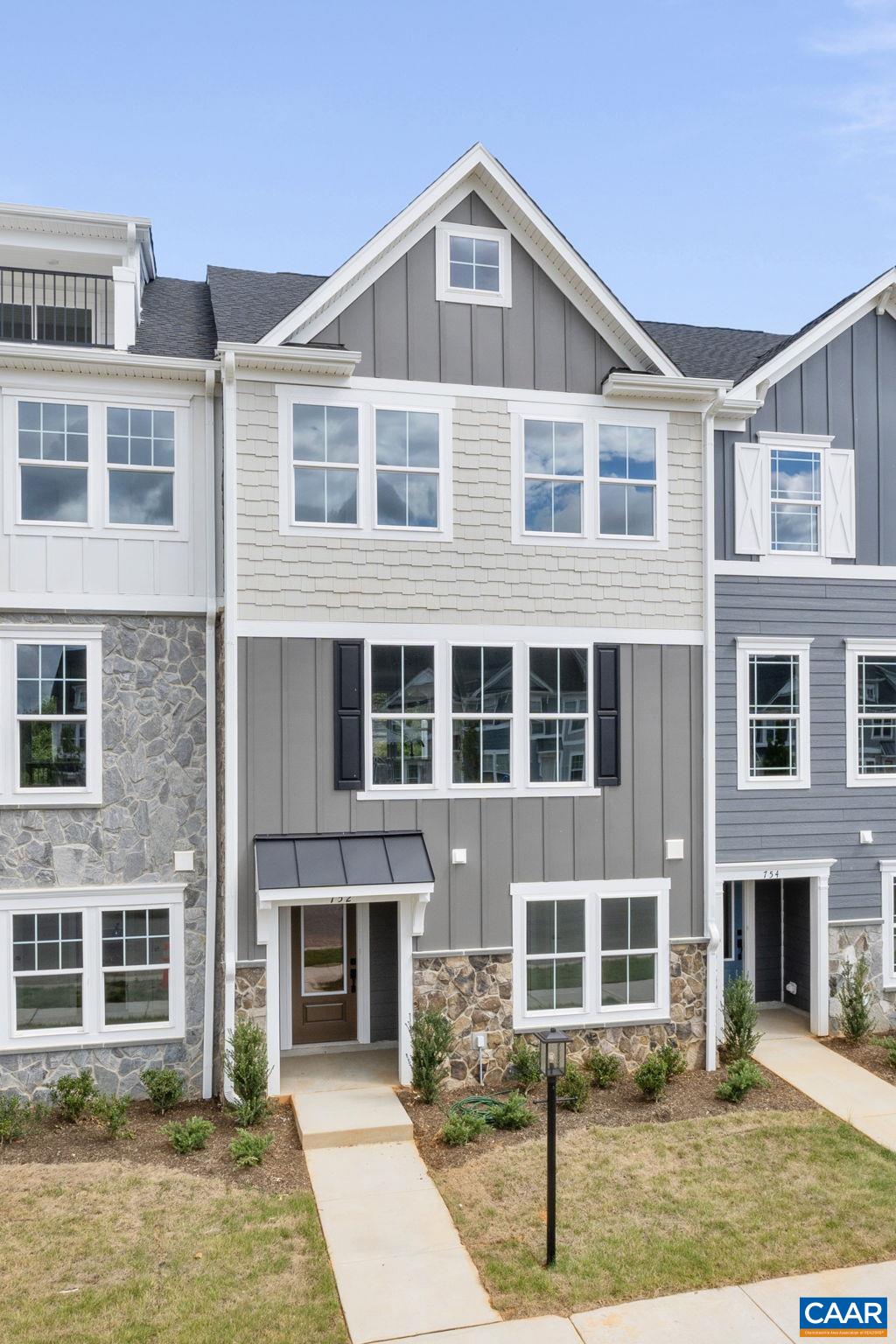 107 Park Ridge Drive Crozet, VA 22932 - Photo 2 of 42 a front view of a residential apartment building with a yard