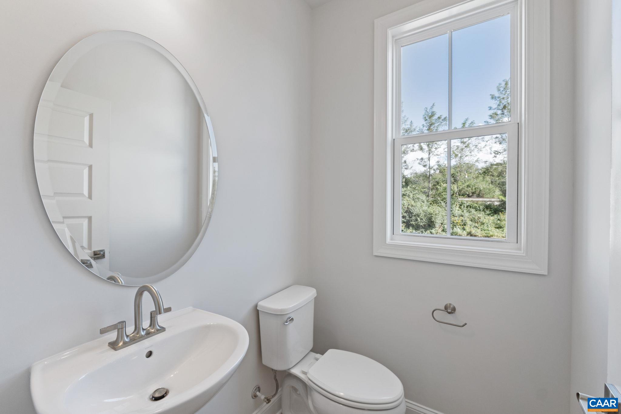107 Park Ridge Drive Crozet, VA 22932 - Photo 22 of 42 a bathroom with a toilet a sink and mirror