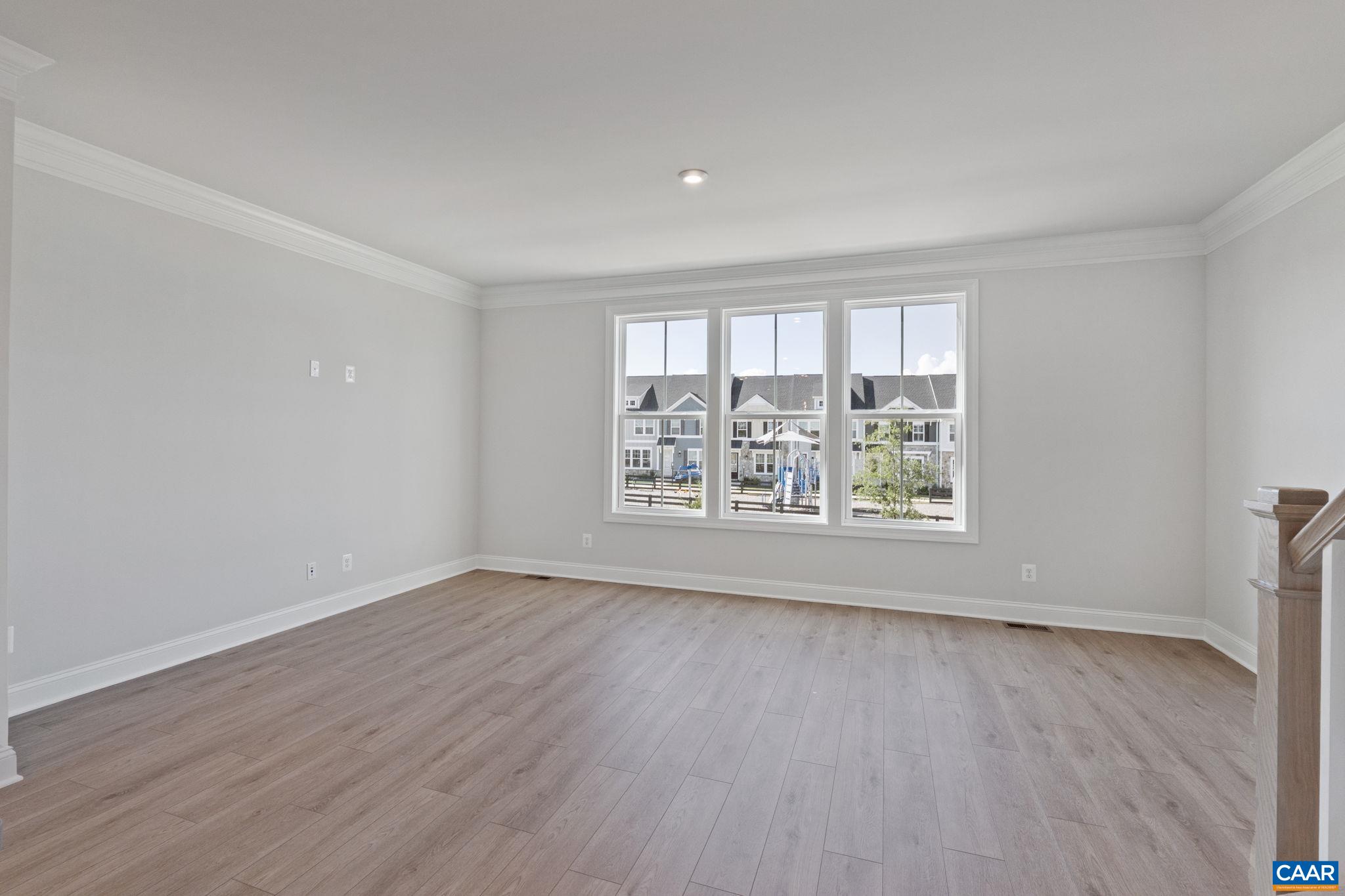 107 Park Ridge Drive Crozet, VA 22932 - Photo 24 of 42 an empty room with wooden floor and windows