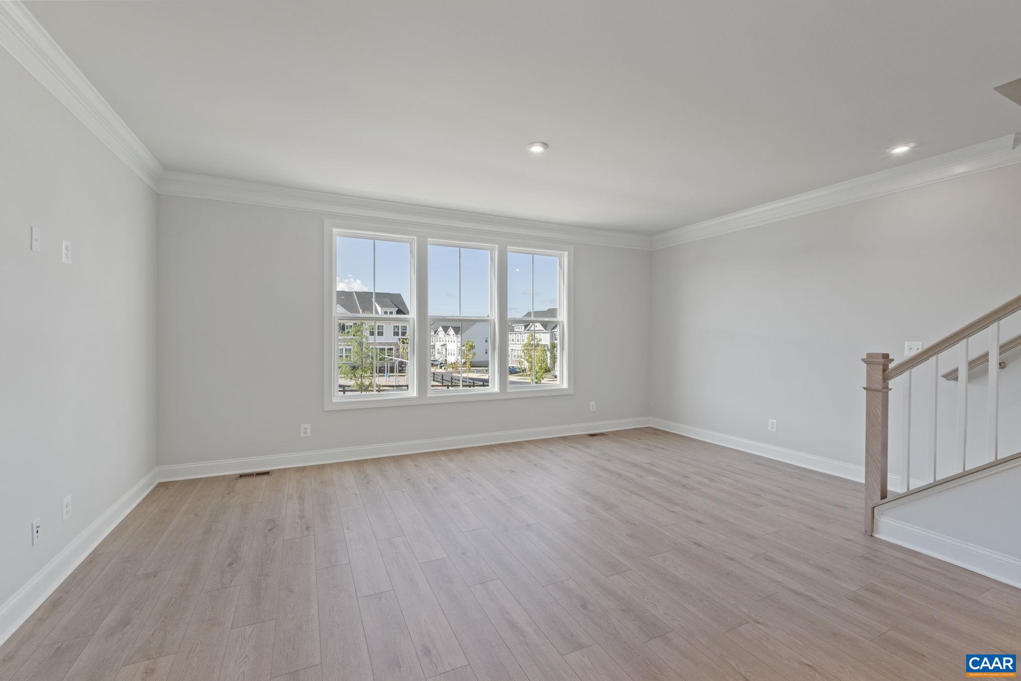 107 Park Ridge Drive Crozet, VA 22932 - Photo 25 of 42 a view of an empty room with wooden floor and a window