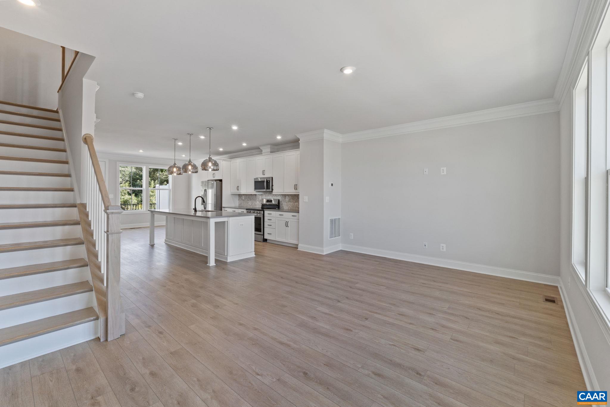 107 Park Ridge Drive Crozet, VA 22932 - Photo 27 of 42 a view of a kitchen with wooden floor and electronic appliances