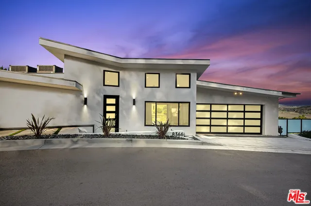 a front view of a house with a garage