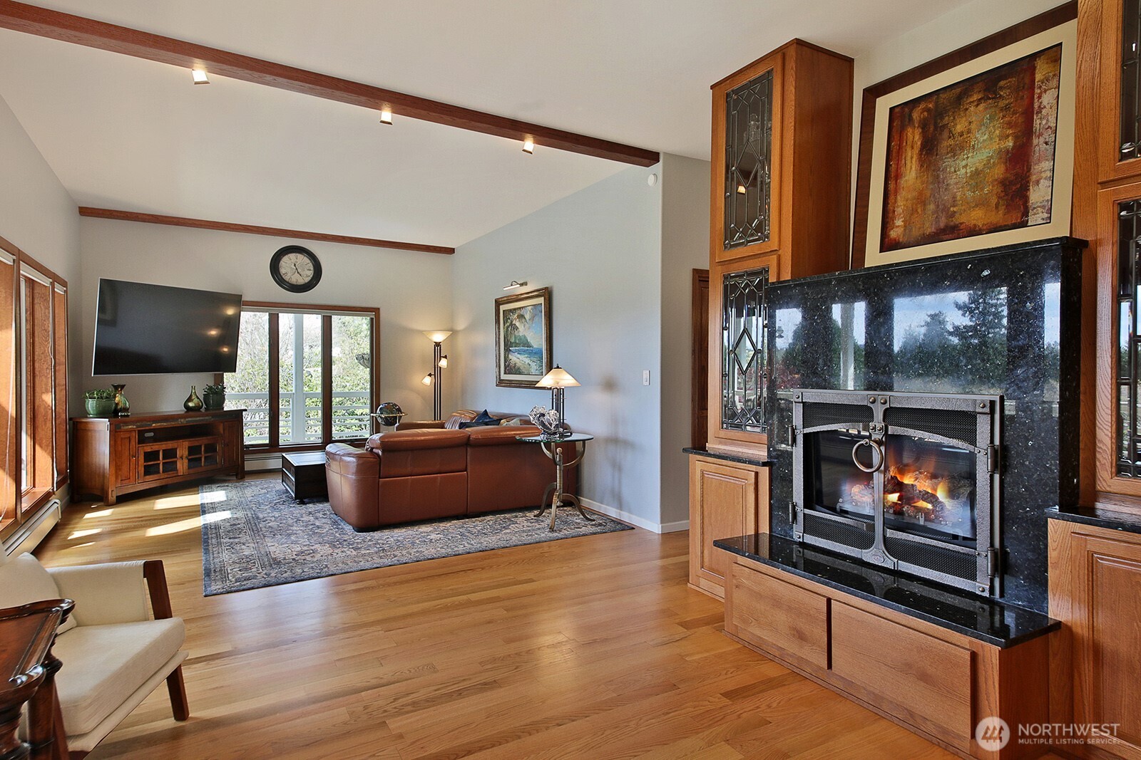 5741 Crow Haven Road Langley, WA 98260 - Photo 26 of 40 a living room with furniture and a fireplace
