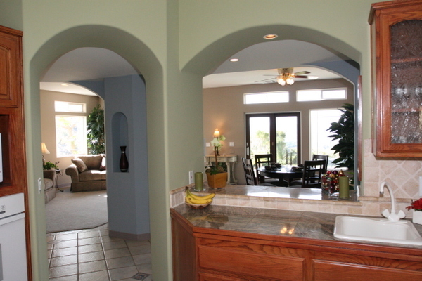 1498 Farnham Road Ojai, CA 93023 - Photo 5 of 10 a kitchen with a sink and a large mirror with potted plant