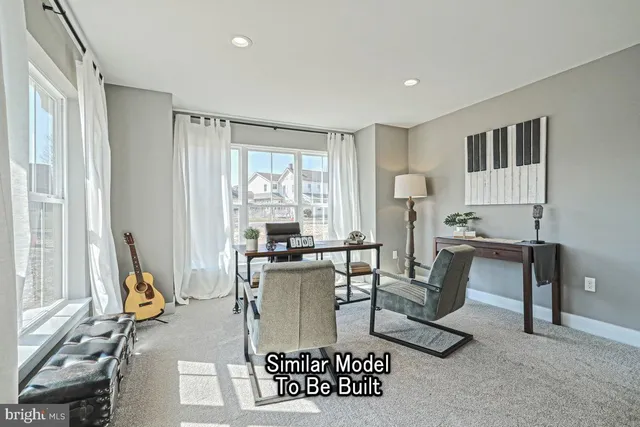 a living room with furniture a window and a table